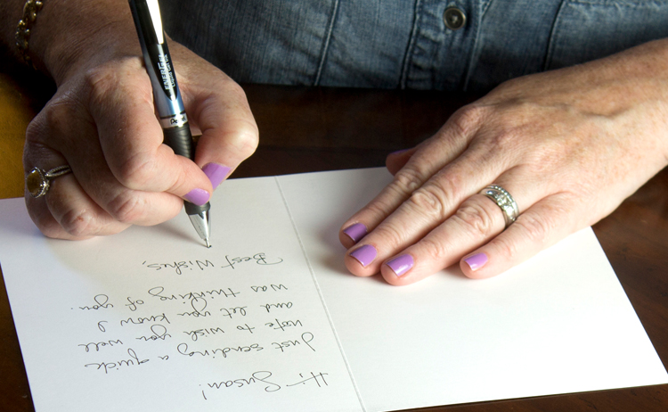 Woman hand writing a card