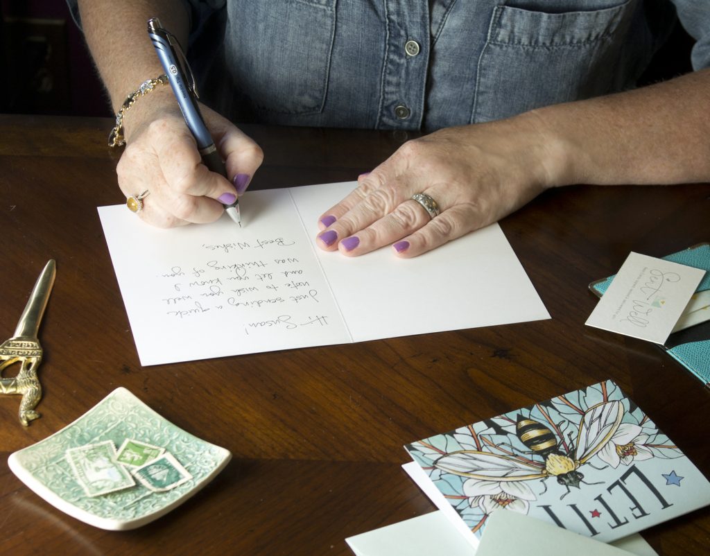 Woman hand writing a card